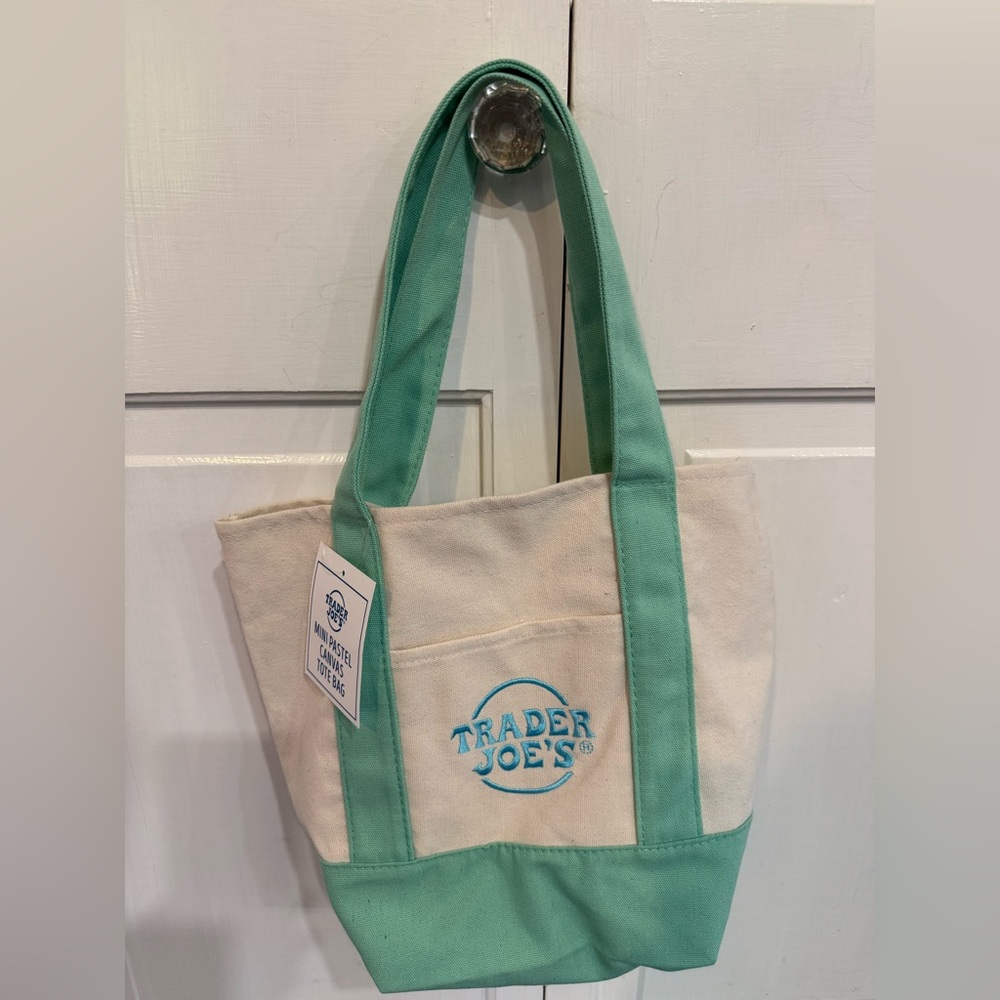 Trader Joe’s
Highly sought after mini canvas bag 
BNWT